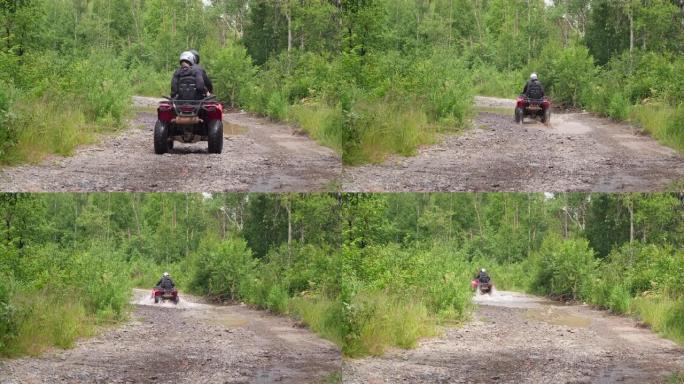 人们在森林里驾驶四轮摩托
