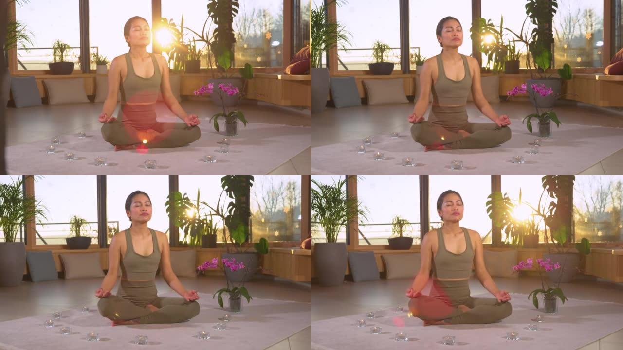 慢动作: 亚洲女性在莲花姿势冥想练习呼吸技术