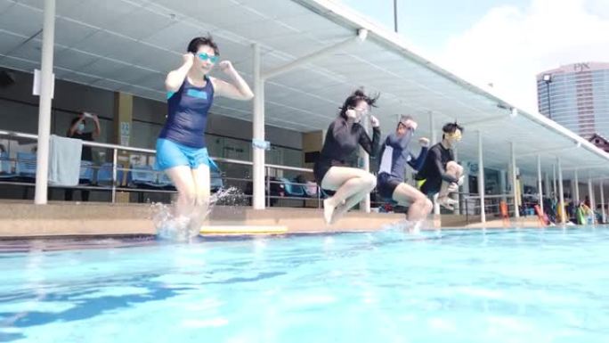 冒险冒险亚洲华人家庭跳进泳池快乐享受