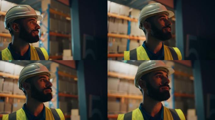 戴着安全帽的拉丁男性工人的肖像在仓库外面走了几步，微笑着，若有所思地望着远处。职业前线英雄戴着时尚的
