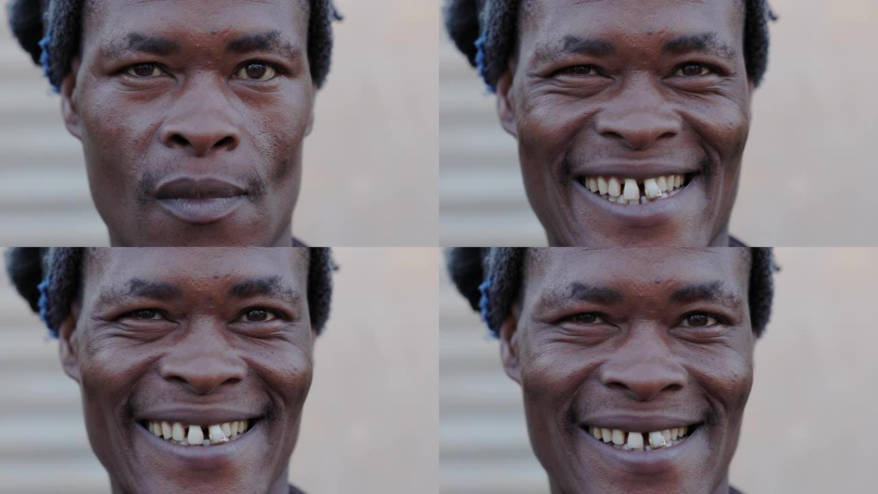 一个微笑的非洲黑人成年男子的特写面部肖像