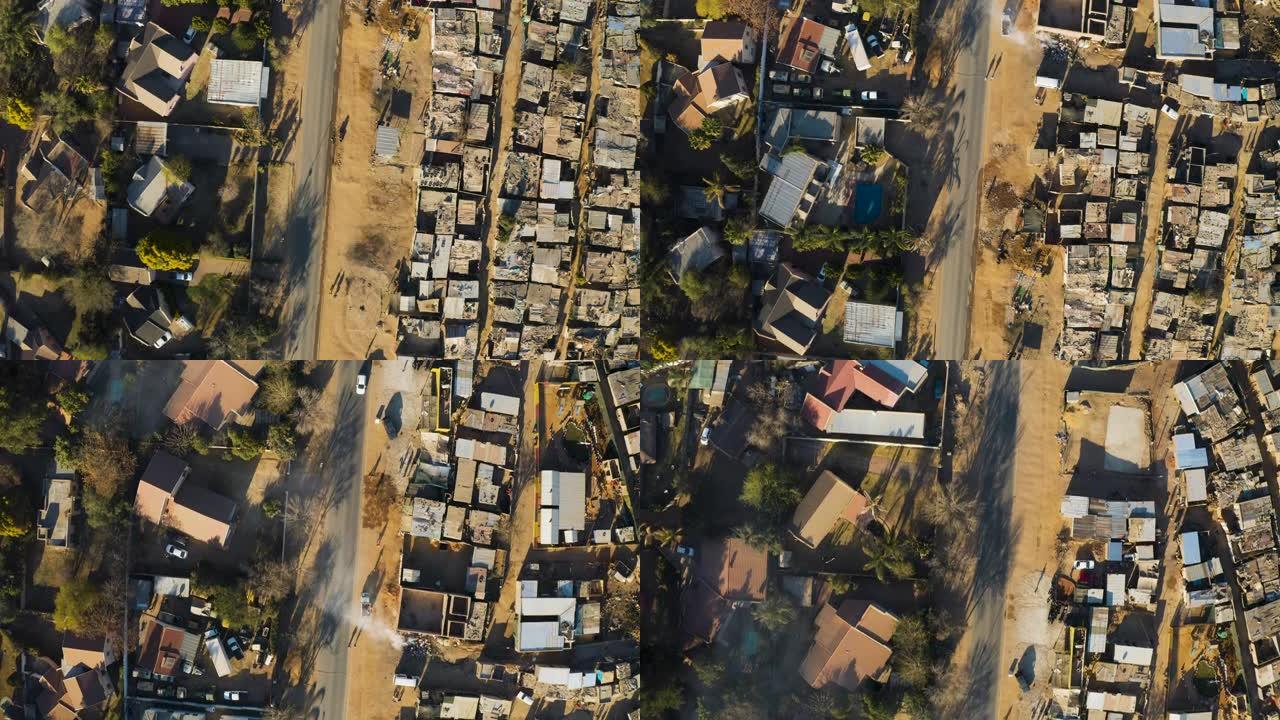 不平等。非正式定居点Kya Sands棚户区的空中特写直下视图，就在南非豪登省中产阶级郊区住房旁边