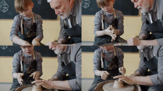 专业陶工教小学生在陶艺课上使用抛掷轮