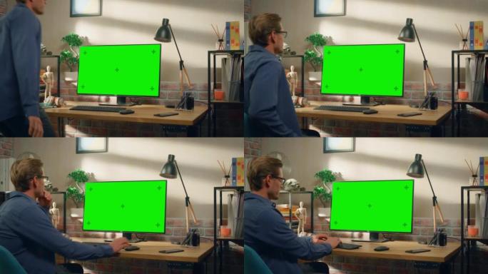 年轻英俊的男人坐下来在家工作，台式电脑上有绿屏模拟显示。创意男性查看社交媒体，浏览互联网。明亮阁楼公