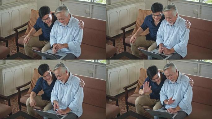 年长的父亲和年幼的儿子在视频会议上挥手打招呼，面对镜头微笑非常高兴