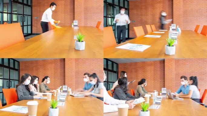 4K UHD Dolly延时新的正常会议和头脑风暴在会议室用洗手液，所有商务人员都戴上防护口罩，以防