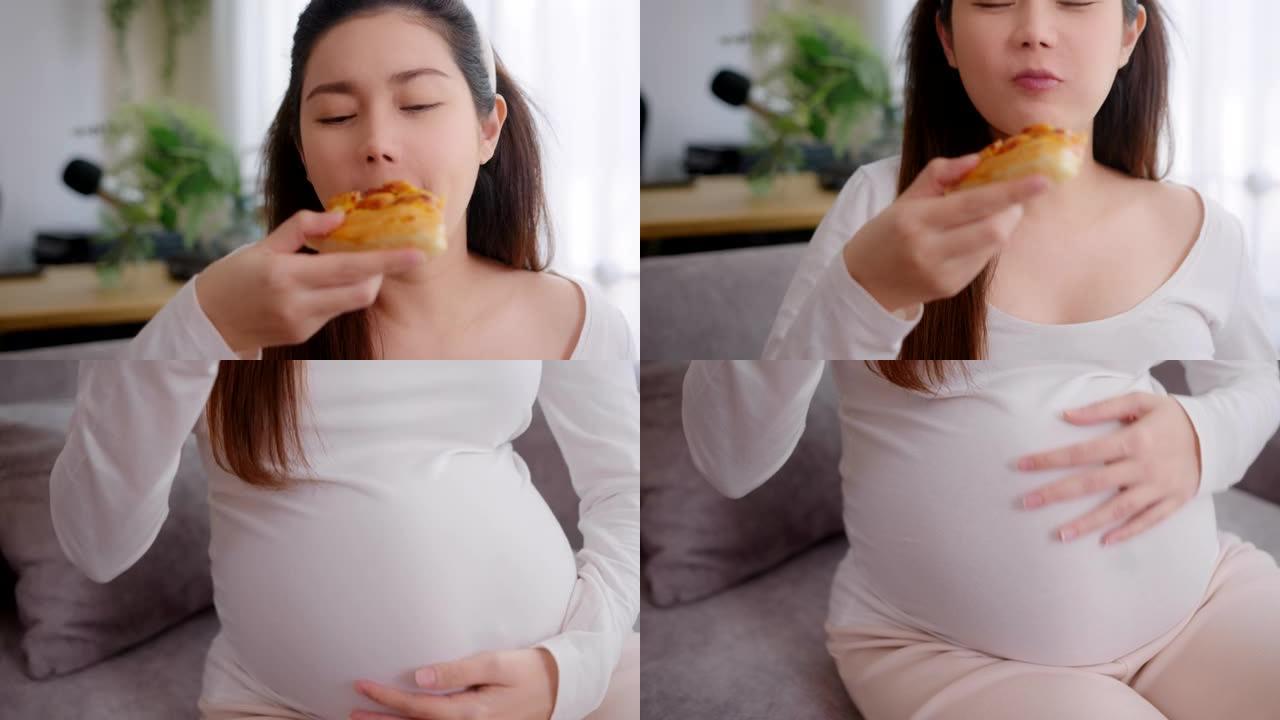 孕妇在家吃披萨不健康的食物。