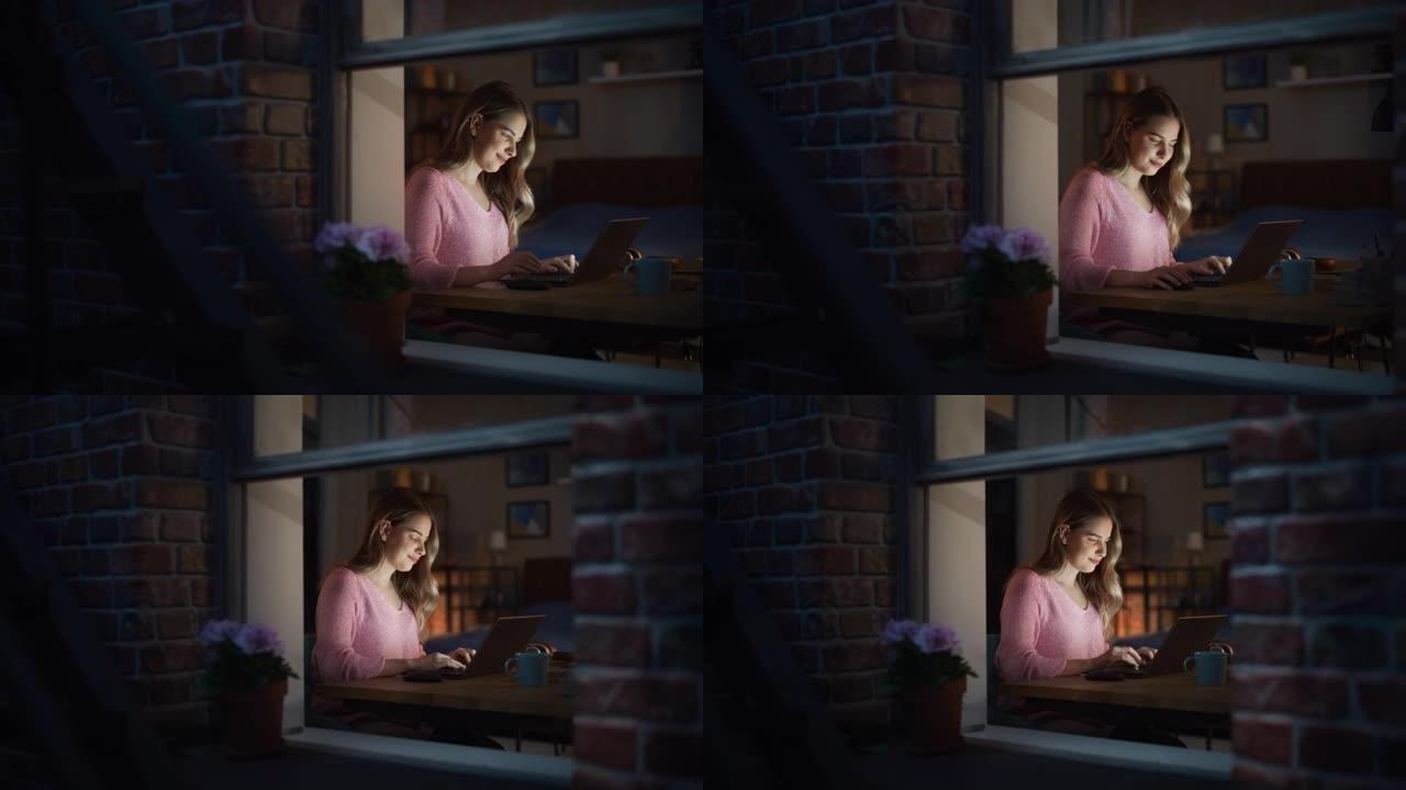 在舒适的卧室里，一个美丽的微笑的年轻女子在笔记本电脑上工作的肖像照片。快乐的女性在社交媒体上思考和聊
