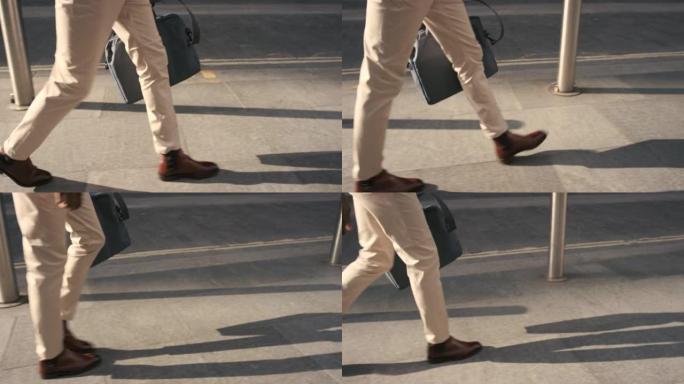 一个无法识别的商人在城市中行走的特写镜头