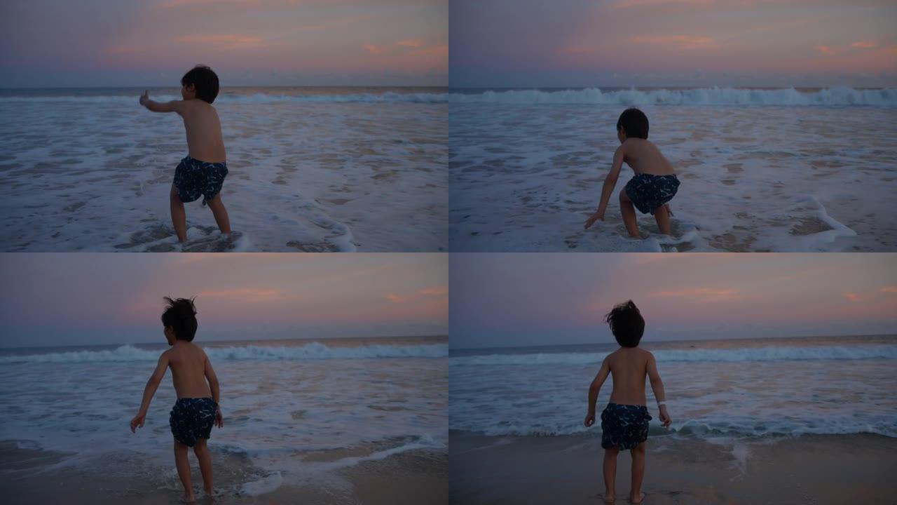 小孩在海滩上泼水和跳跃的背景图非常兴奋