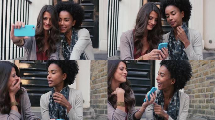 两个女性朋友坐在外面一起自拍的4k视频片段