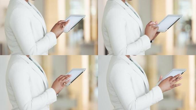 女商人用手在数字平板电脑空白屏幕上打字来监控办公室员工的表现。使用在线技术软件进行业务项目的专业执行