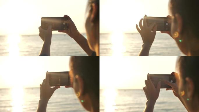 亚洲女孩在海滩度假拍照