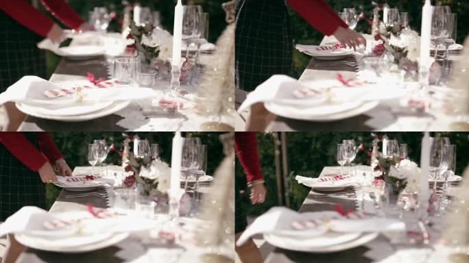4k视频片段，一名面目全非的女人在家里摆桌子，为圣诞节聚会做准备
