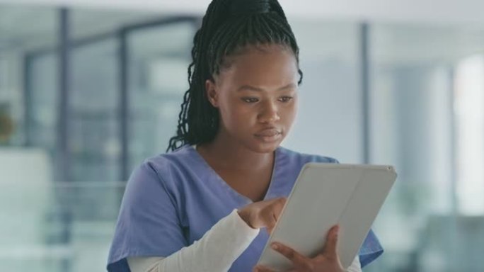 一名年轻女医生在工作中使用数字平板电脑的4k视频片段