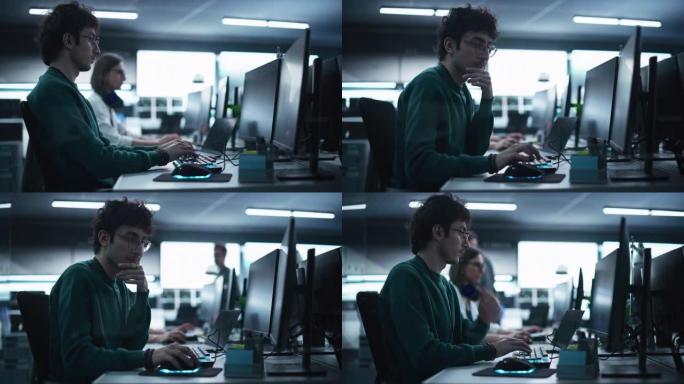 在技术办公环境中，一位周到的工程师在台式计算机上工作的肖像。研发部门为一个创新的互联网项目编写软件代