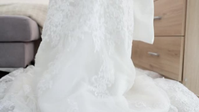 婚礼，新娘准备礼服适合结婚活动的魅力和特殊庆祝活动。白色婚纱女性时尚，优雅时尚的蕾丝线设计。