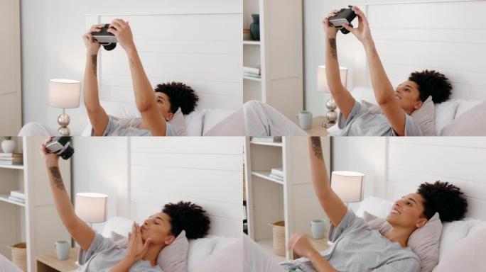 相机，黑人妇女和自拍照在床上，快乐，微笑和放松的女孩摆姿势，嬉戏并在家里玩得开心。摄影，摄影师和女人