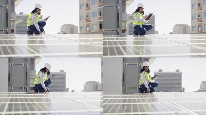 美丽快乐自信的多民族年轻黑发女工程师使用数字平板电脑检查蓝图，计划，示意图，同时在建筑工地安装太阳能