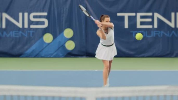 体育电视女子网球锦标赛上有3D特效球。女子网球运动员用球拍发球，球飞入屏幕。直播网络频道电视。VFX