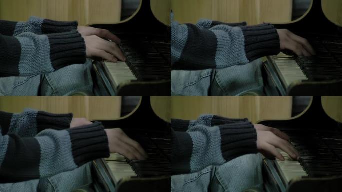 钢琴家动手琴键。特写。