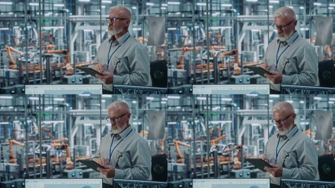汽车厂办公室: 高级白人男性总工程师肖像使用平板电脑在自动化机器人手臂装配线上制造高科技电动汽车。静