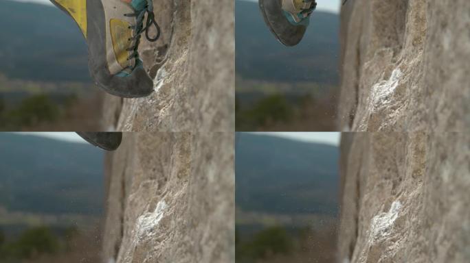 宏观: 当女人爬上悬崖时，白色镁粉漂浮在岩石周围。