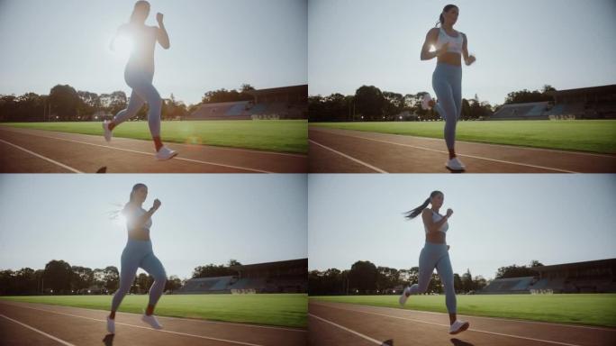浅蓝色运动上衣的美丽运动员在户外体育场跑得非常快。她在一个温暖的夏日下午冲刺。精女正在慢跑训练。慢动