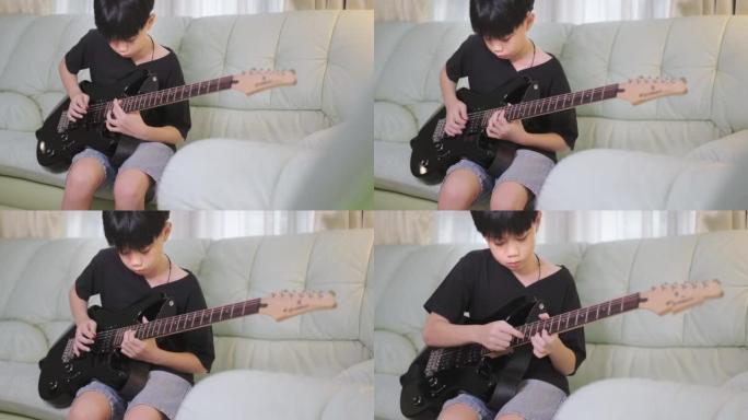 玩电吉他的亚洲男孩