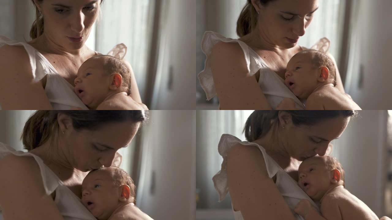 新生婴儿的真实肖像在母亲的怀抱中平静地休息，母亲唱摇篮曲并亲吻他。一个女人和她的孩子之间温柔快乐的时
