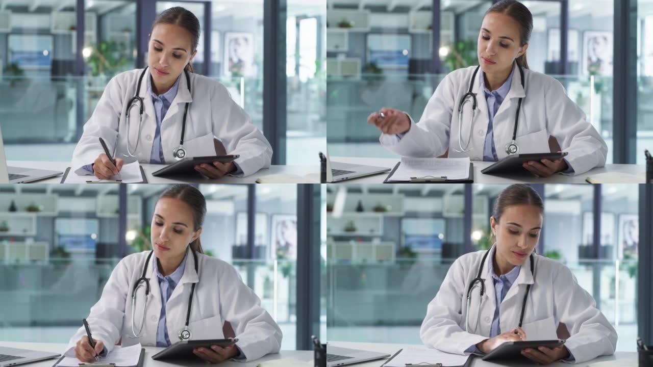 一位年轻医生在现代医院的办公桌上写笔记和使用数字平板电脑的4k视频片段