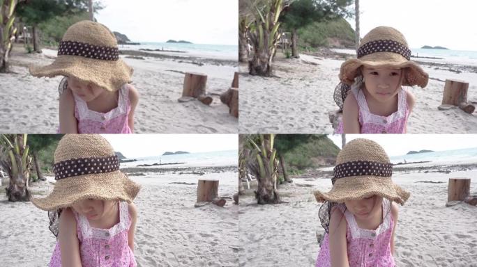 快乐的小女孩在夏天的海滩上玩秋千