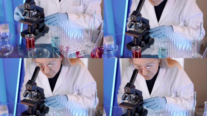SLO MO女科学家在实验室使用显微镜
