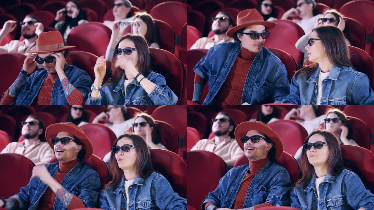 观众在电影院戴上3D眼镜