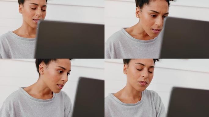 黑人女性笔记本电脑，在家中远程工作中阅读电子邮件通讯并思考问题。自由文案写作的女人，将注意力集中在计