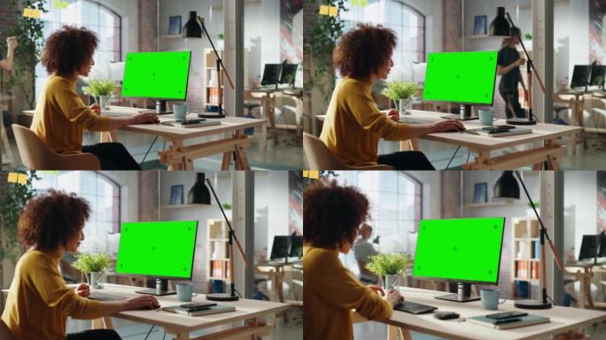 中东女性在创意机构工作，为客户实施现代商业战略。成功的专家使用带有绿屏模拟显示的计算机。放大镜头。
