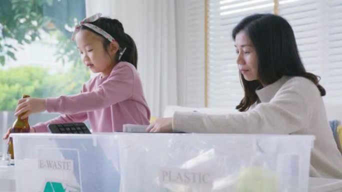 孩子们学习生态绿色垃圾垃圾分类，用于瓶库再利用。