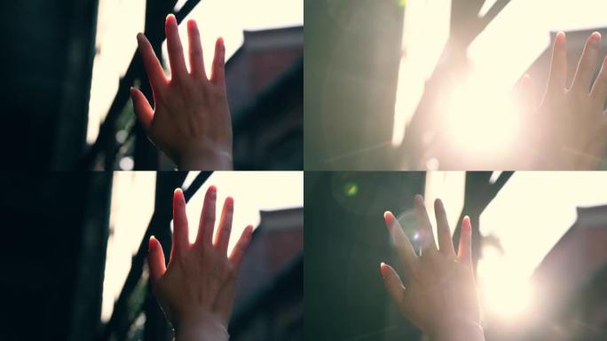 从窗户透过手指的阳光