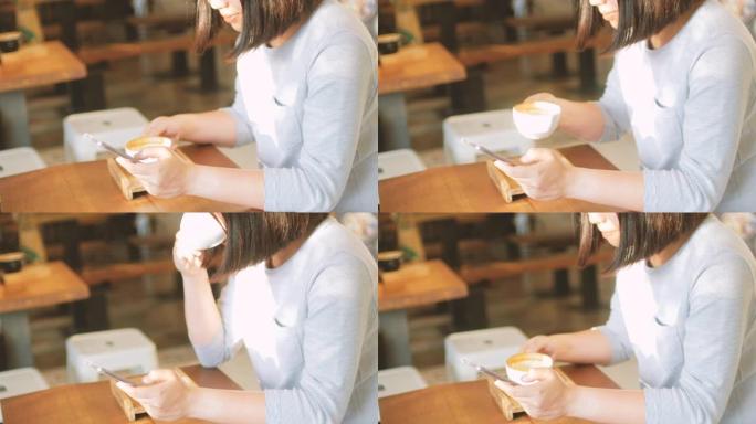 女人喝咖啡，在咖啡馆用手机