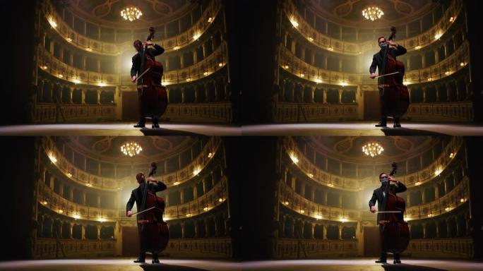 戴着保护性医用口罩的男性大提琴手的电影镜头正在独奏大提琴