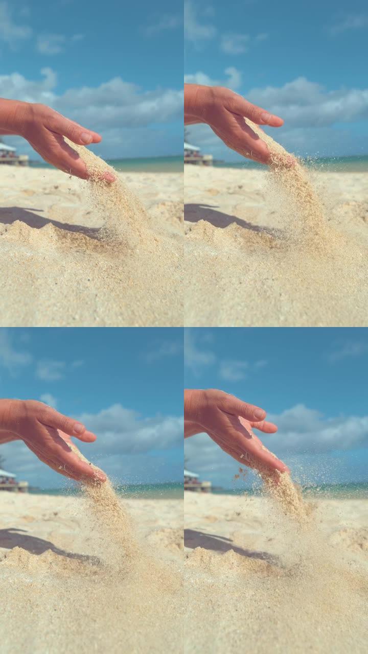 垂直慢动作无法识别的女人在阳光明媚的沙滩上玩热沙