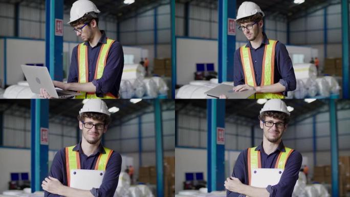 工厂里拿着电脑笔记本电脑的男工程师肖像