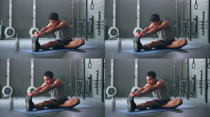 男人，在健身，锻炼或训练强壮的肌肉，心脏健康或有氧健康的健身房地板上休息和伸展。日本私人教练，运动人