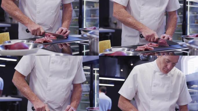 高加索男厨师穿着厨师白人在餐厅厨房在切菜板上切肉