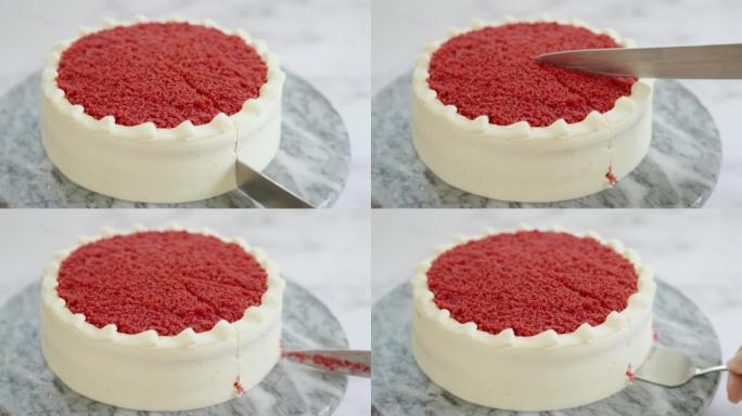 用刀手切一块红色天鹅绒蛋糕