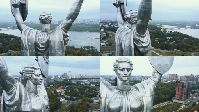 祖国纪念碑雕像的超级特写空中拍摄，俯瞰着夏季第聂伯河上风景秀丽的基辅城市全景。