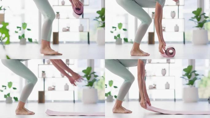 女人在瑜伽健身训练室的地板上铺开瑜伽垫。积极健康的赤脚女性准备家庭锻炼，以平衡的身心过上健康的生活方