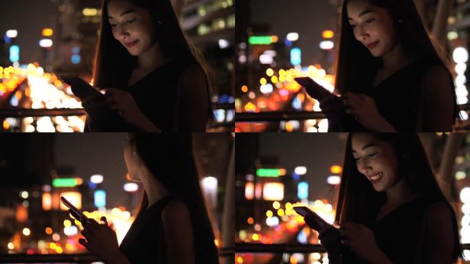 幸福女人下班后在智能手机上发短信街景
