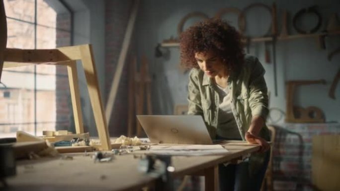 Multiethnic Artisan Arab Woodworker Using Laptop C