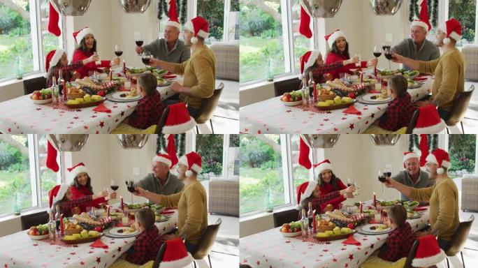 快乐的高加索多代家庭戴着圣诞老人的帽子，吃圣诞大餐，烤面包